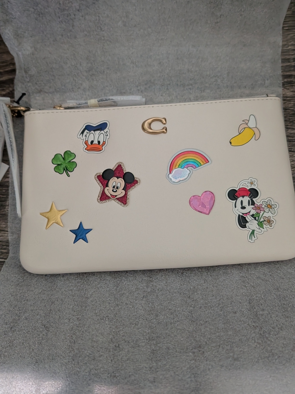 Coach Cream Wristlet with Disney Character Patch Accents